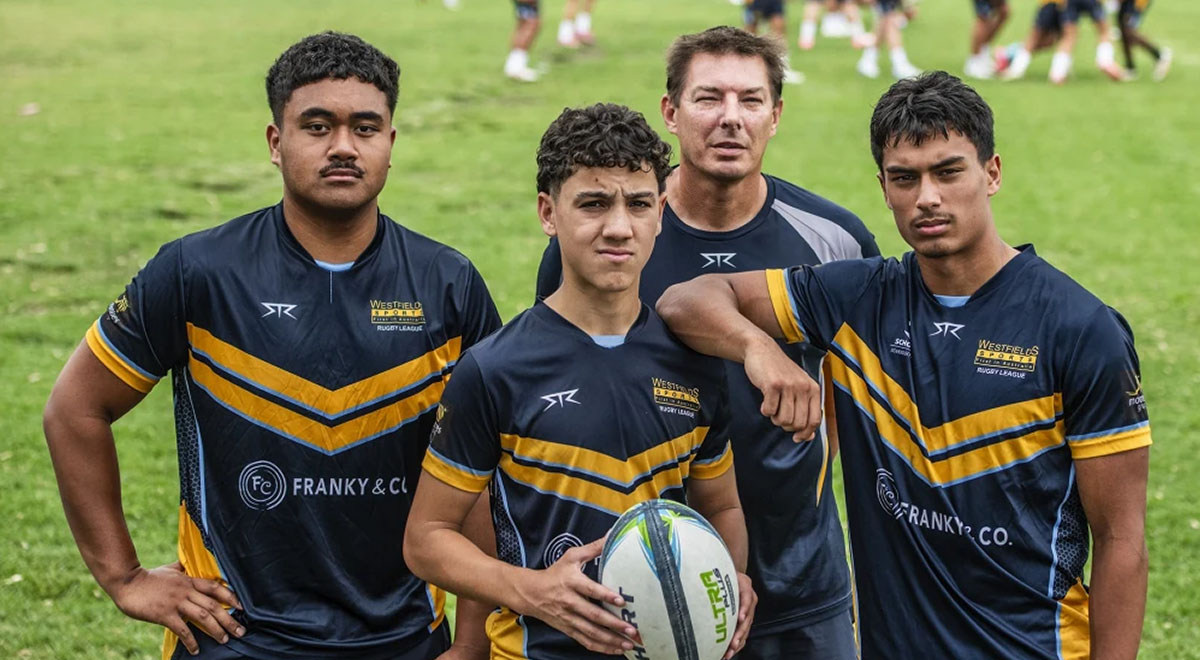 Director of Sport Troy Weeden behind schoolboy players Caleb Wright, Jesse Ropata, and Daniel McBride.